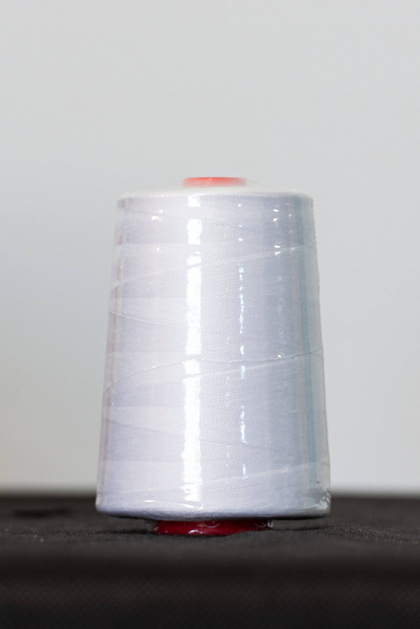 white spun polyester-wrapped thread